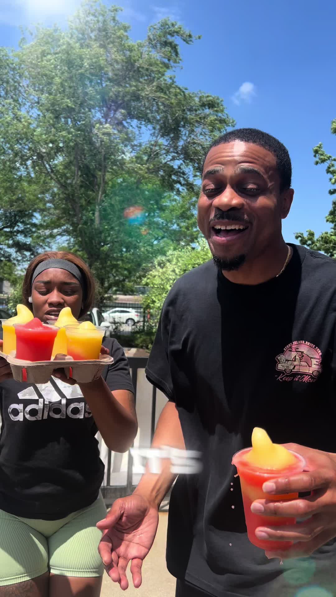 Strawberry mango lemonade slushes in the sun